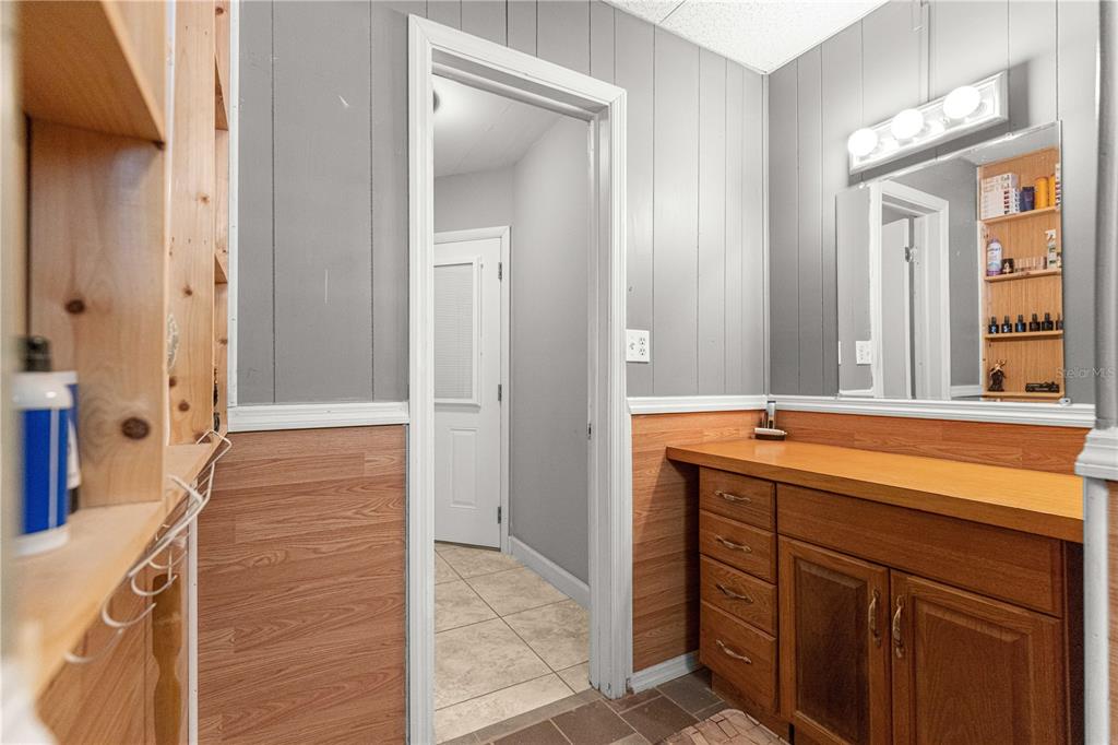 6401 East Holly Street Inverness, FL 34452 - Photo 23 of 51 a bathroom with a sink and a mirror