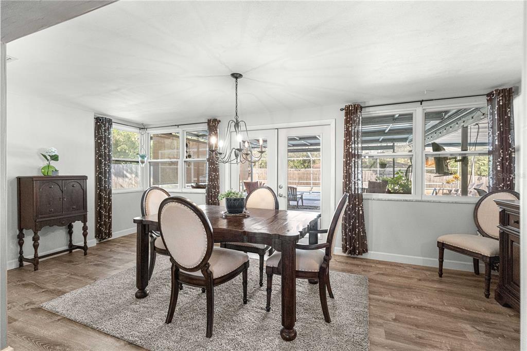 6401 East Holly Street Inverness, FL 34452 - Photo 25 of 51 a view of a dining room with furniture window and outside view