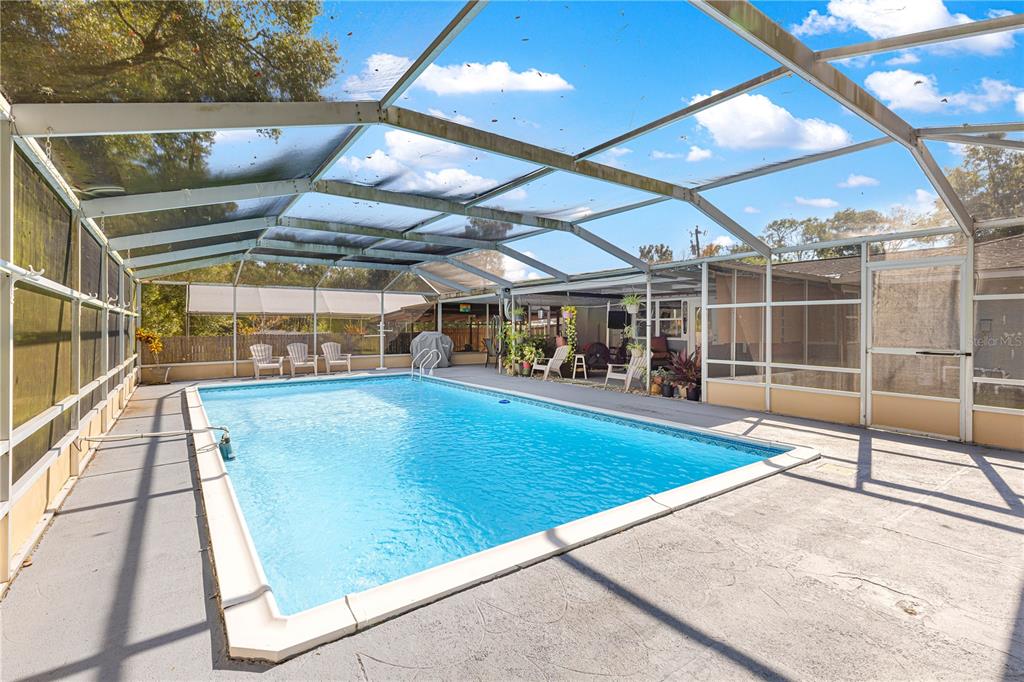 6401 East Holly Street Inverness, FL 34452 - Photo 41 of 51 a view of a swimming pool with a patio