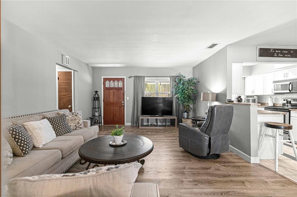 6401 East Holly Street Inverness, FL 34452 - Photo 47 of 51 a living room with furniture and a wooden floor