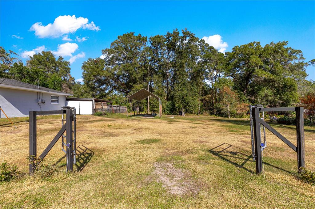 6401 East Holly Street Inverness, FL 34452 - Photo 48 of 51 a view of swimming pool with a slide