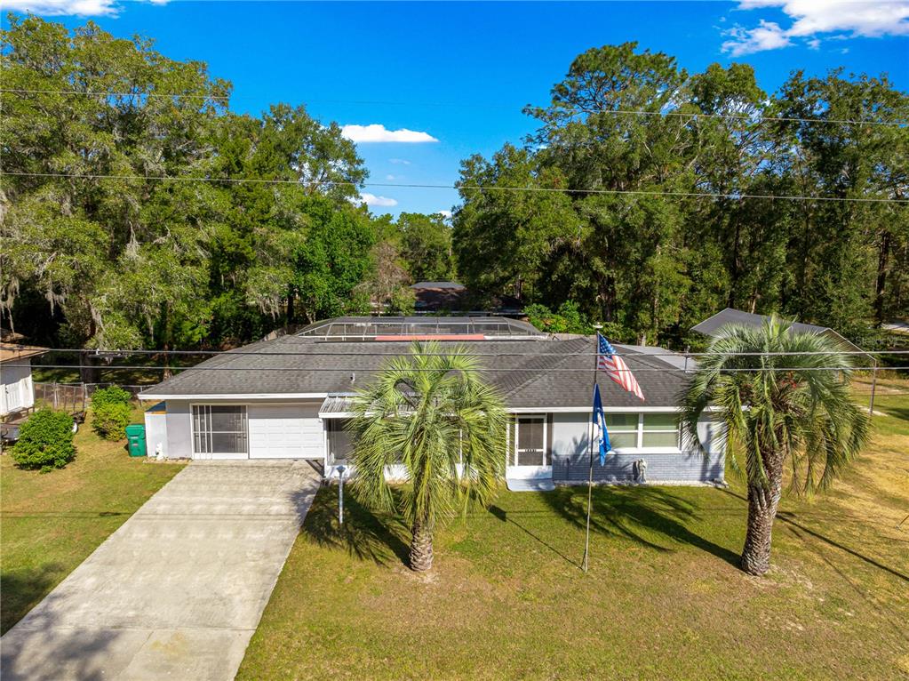 6401 East Holly Street Inverness, FL 34452 - Photo 5 of 51 an aerial view of a house with swimming pool and furniture