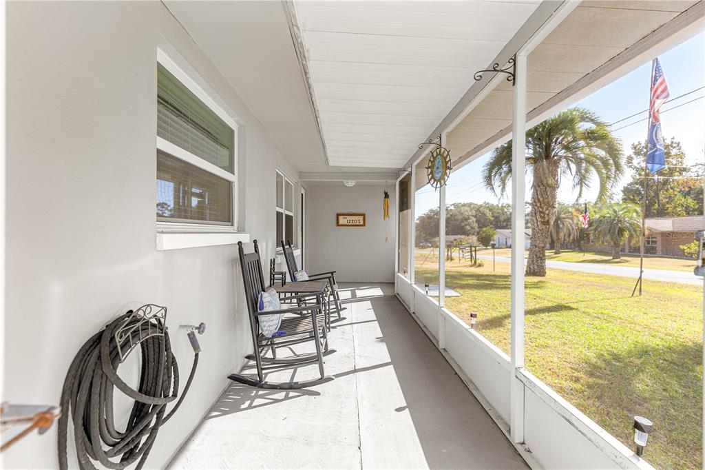 6401 East Holly Street Inverness, FL 34452 - Photo 6 of 51 a view of a swimming pool with outdoor seating