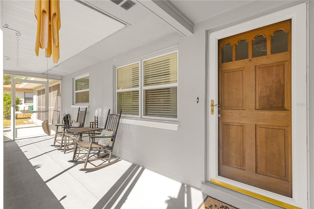 6401 East Holly Street Inverness, FL 34452 - Photo 7 of 51 a view of a dining room with furniture and front door