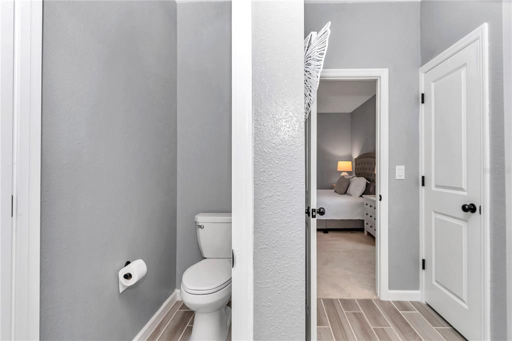 7651 Southwest 74th Loop Ocala, FL 34481 - Photo 43 of 47 a bathroom with a toilet and a view of bathroom