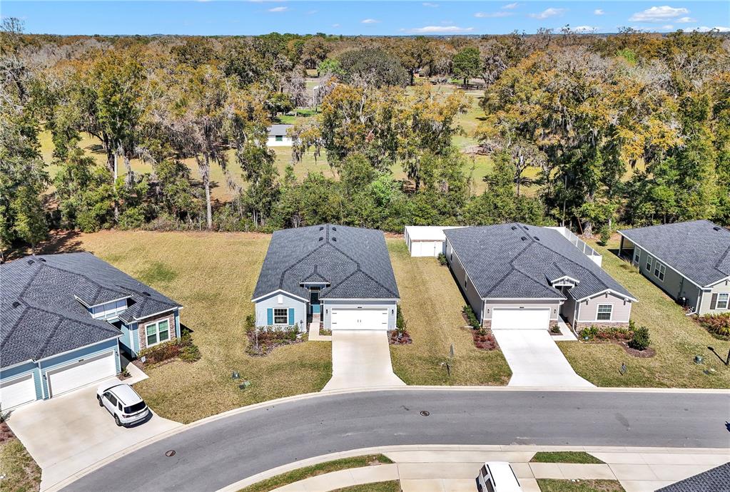 7651 Southwest 74th Loop Ocala, FL 34481 - Photo 5 of 47 an aerial view of residential houses with outdoor space