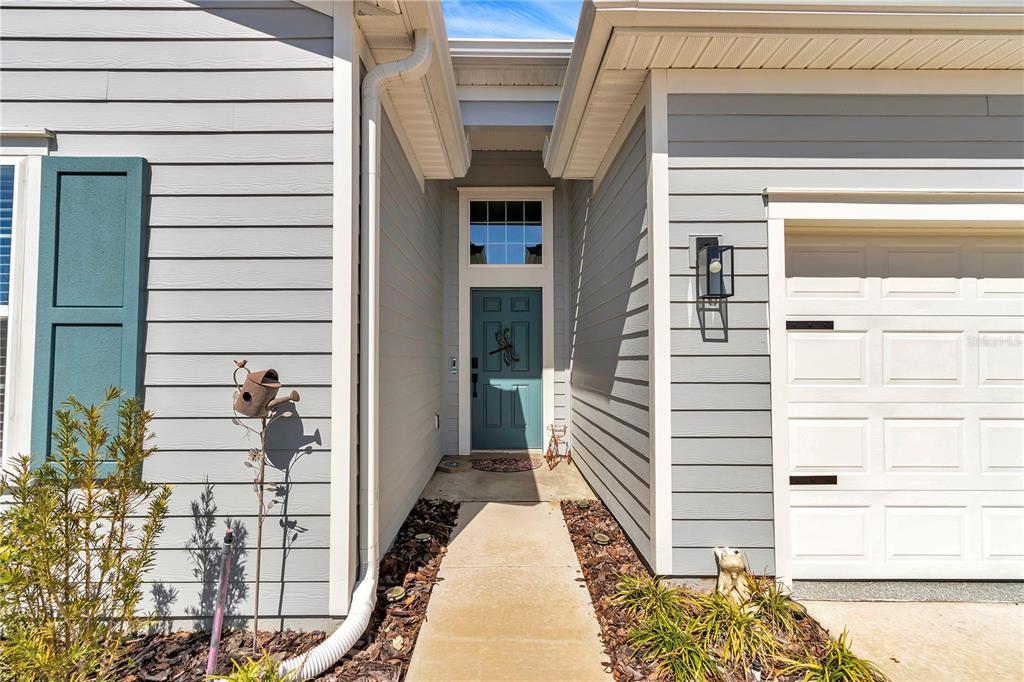 7651 Southwest 74th Loop Ocala, FL 34481 - Photo 6 of 47 a view of a balcony with a potted plant