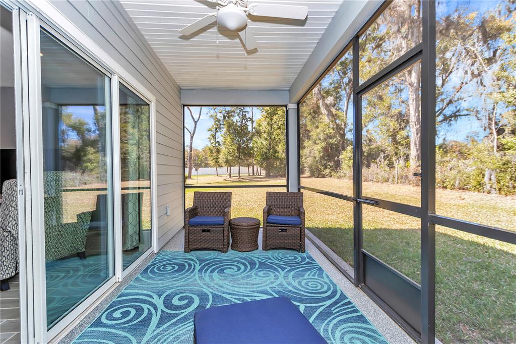 7651 Southwest 74th Loop Ocala, FL 34481 - Photo 8 of 47 a living room with large windows