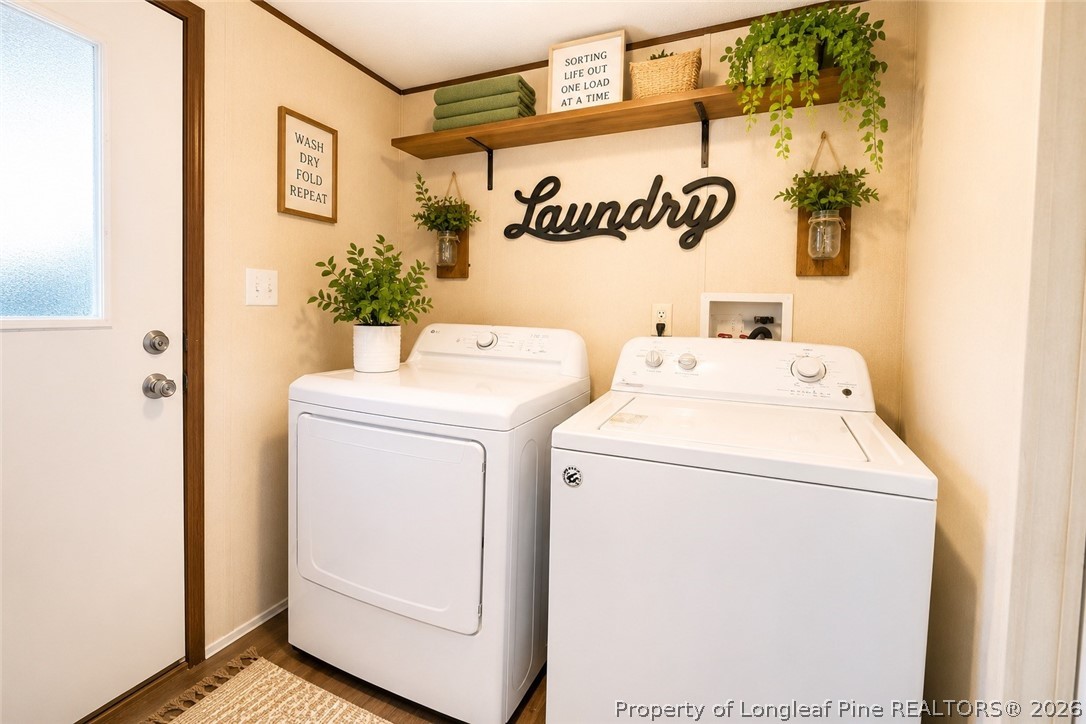 466 Ralph Hunt Boulevard Orrum, NC 28369 - Photo 13 of 17 a utility room with dryer and washer