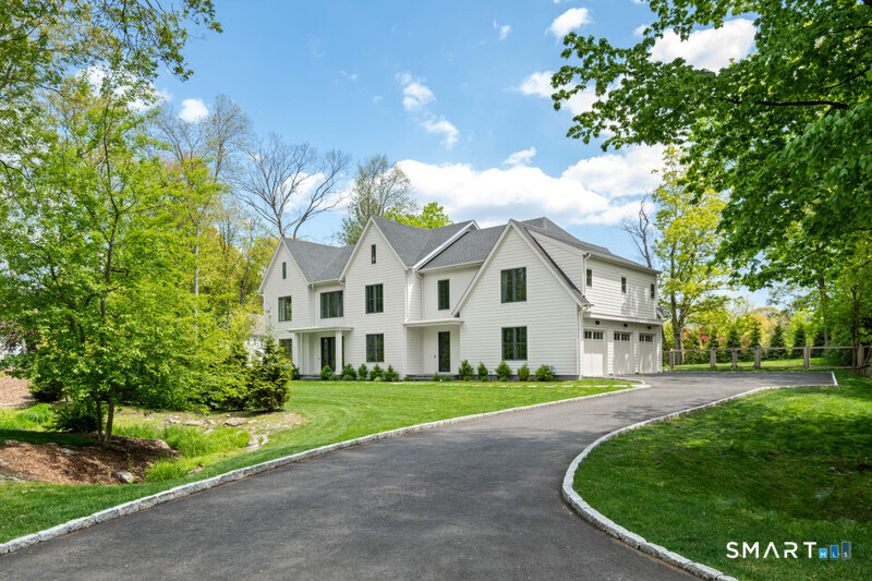 19 Mortar Rock Road Westport, CT 06880 - Photo 1 of 33 a front view of a house with a garden and trees