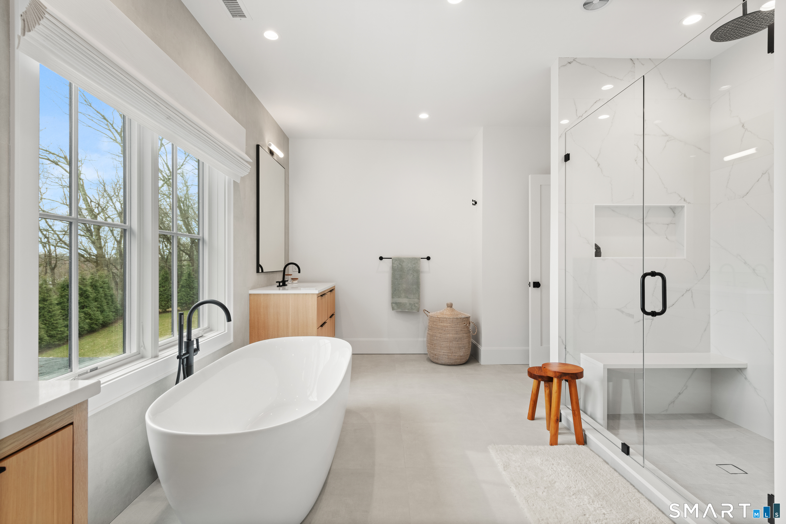 19 Mortar Rock Road Westport, CT 06880 - Photo 22 of 33 a white bath tub sitting next to a bathroom sink