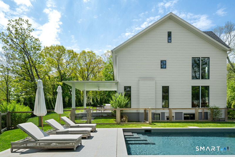 19 Mortar Rock Road Westport, CT 06880 - Photo 29 of 33 a view of house with a big yard and large trees