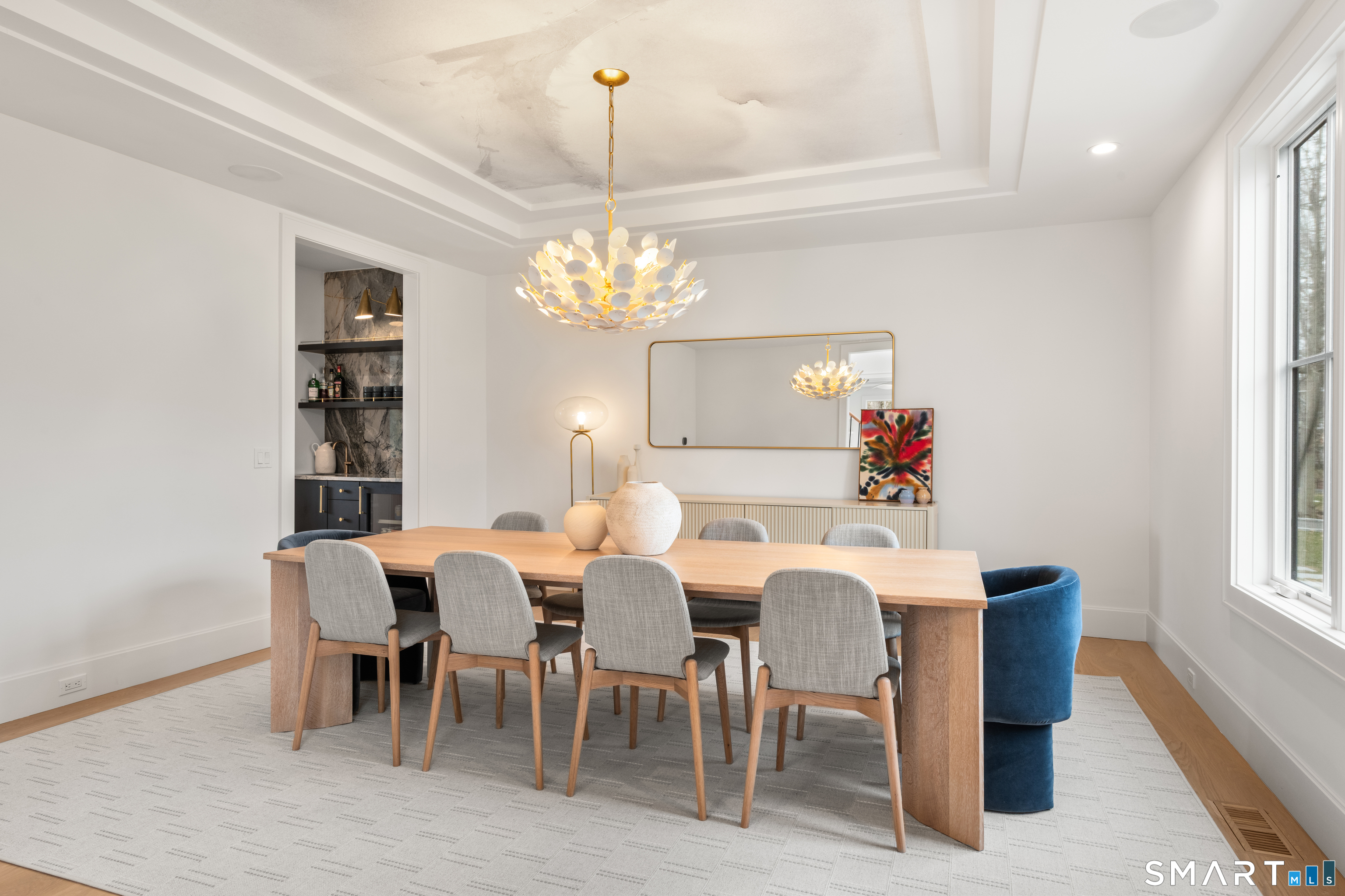 19 Mortar Rock Road Westport, CT 06880 - Photo 6 of 33 a view of a dining room with furniture and chandelier