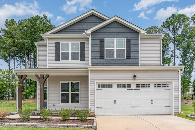 a view of a house with white walls