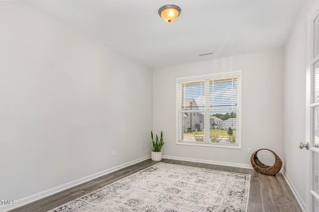 a kitchen with a sink stove top oven and refrigerator