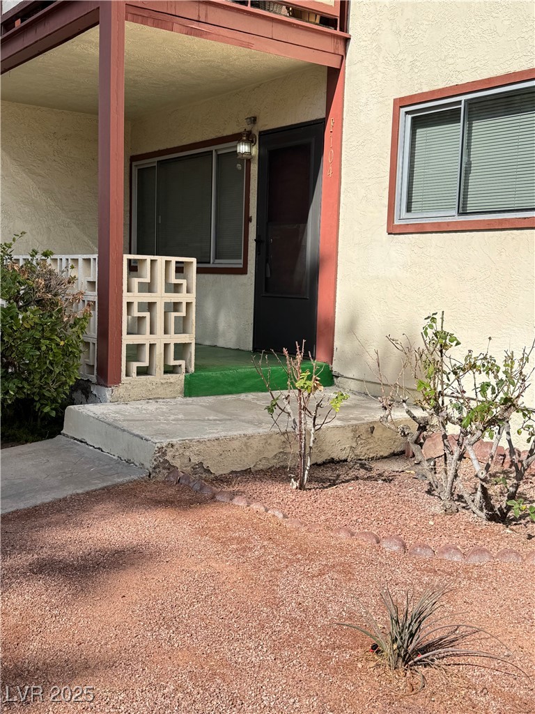 350 East Desert Inn Road, Unit F104 Las Vegas, NV 89109 - Photo 16 of 27 View of exterior entry with stucco siding
