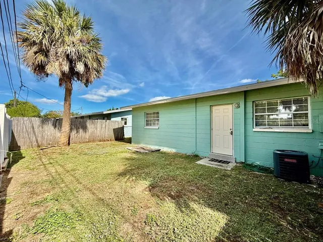 a house view with a backyard space