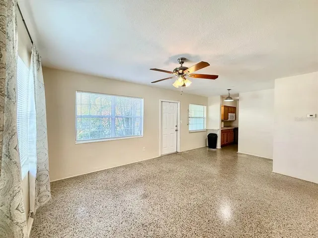 a view of an empty room with a window