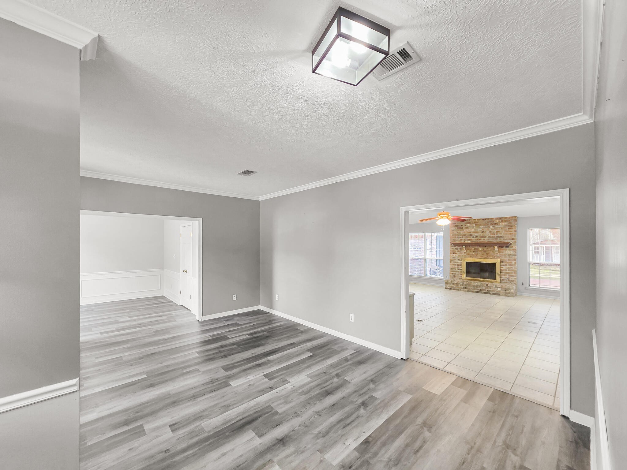 3910 Cypress Point Beaumont, TX 77707 - Photo 15 of 50 a view of empty room with wooden floor and fan