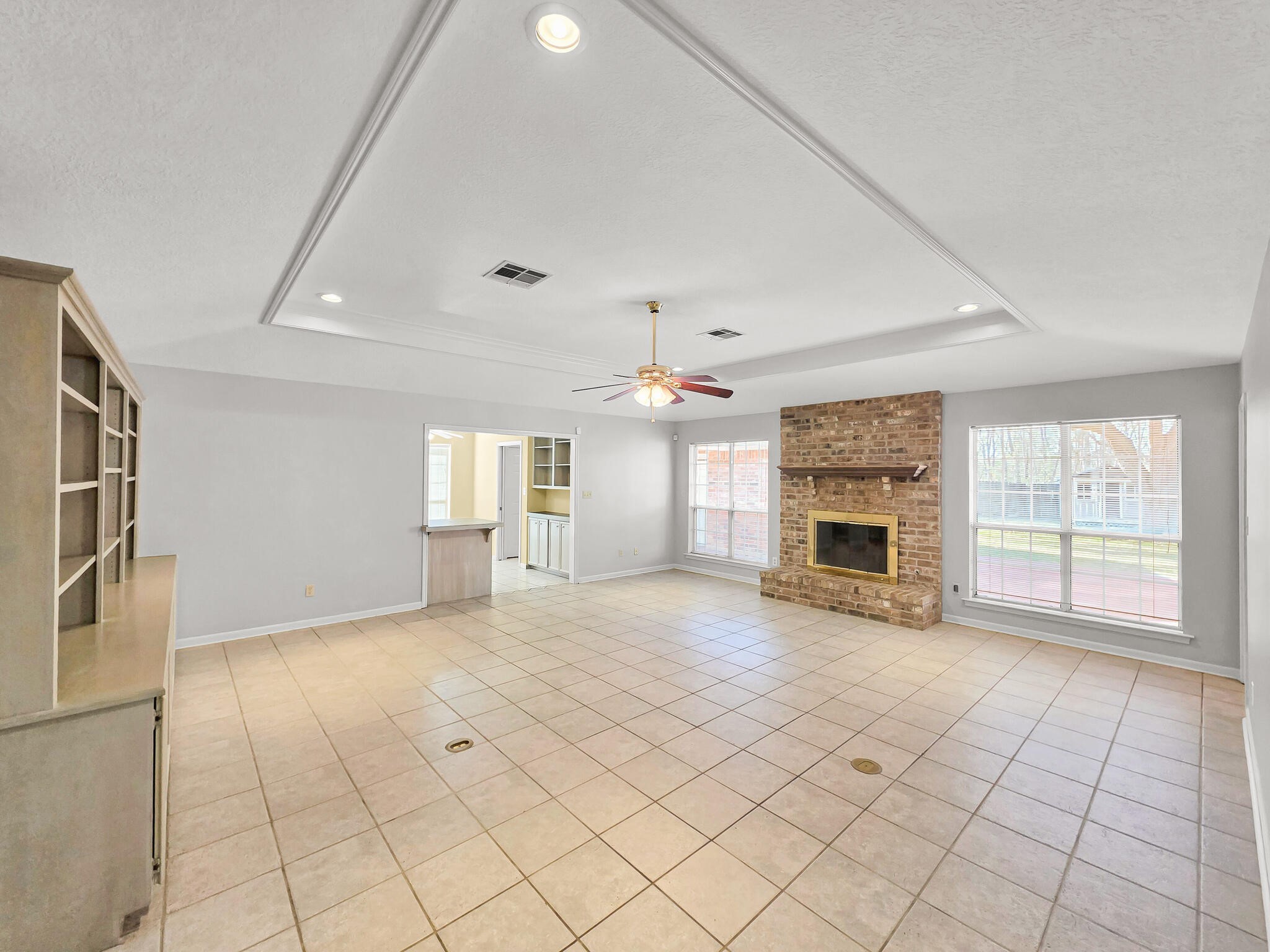 3910 Cypress Point Beaumont, TX 77707 - Photo 24 of 50 an empty room with fireplace and windows
