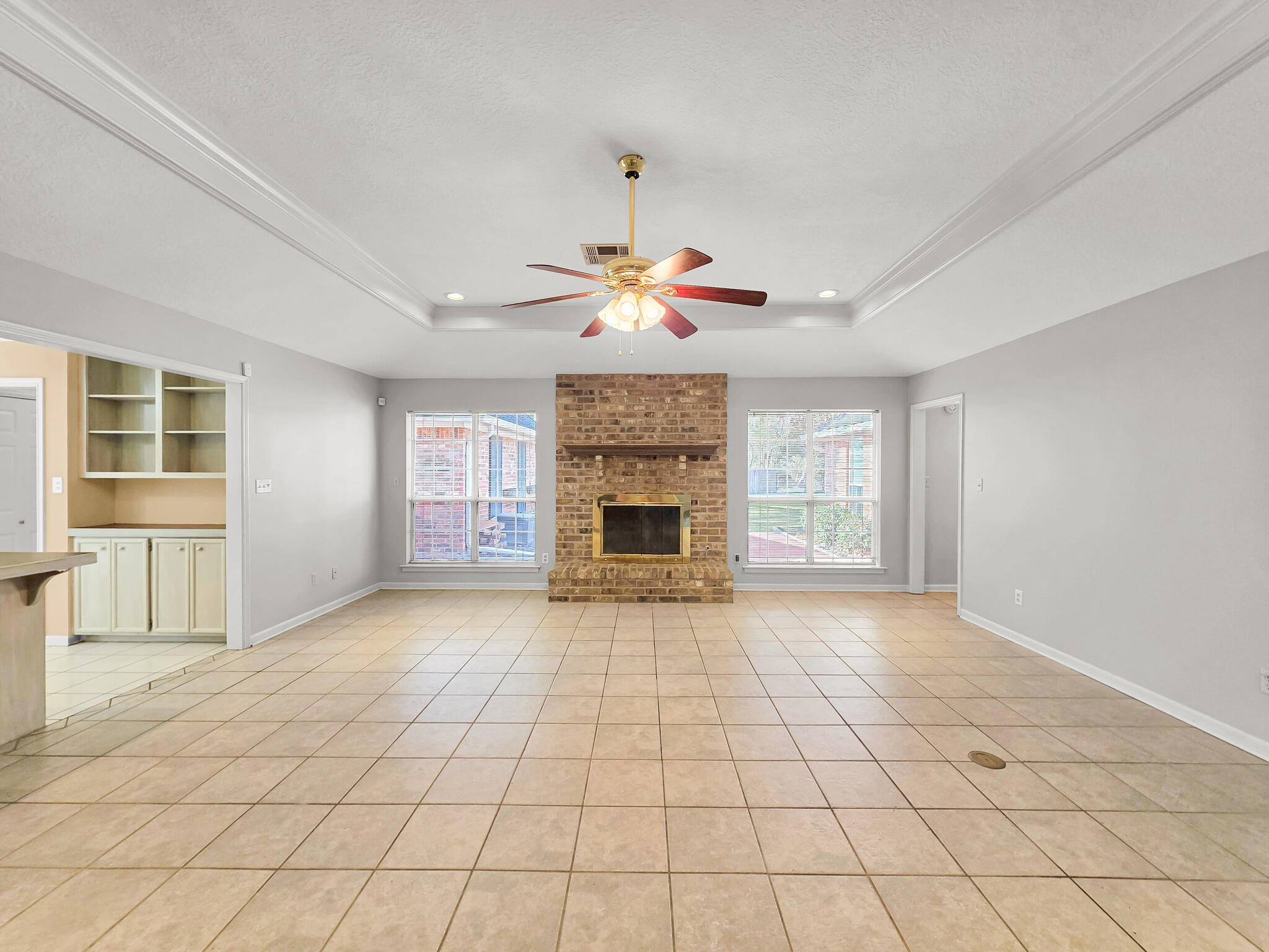 3910 Cypress Point Beaumont, TX 77707 - Photo 25 of 50 a view of an empty room with a fireplace and a window