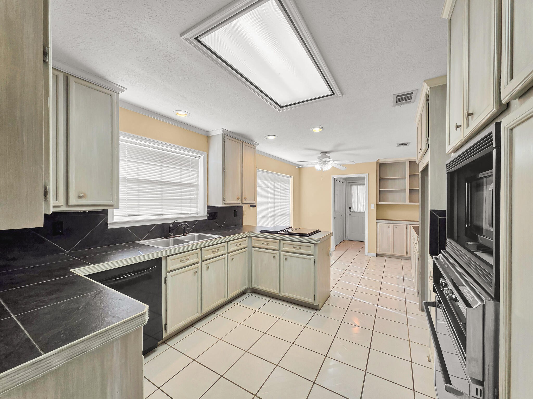 3910 Cypress Point Beaumont, TX 77707 - Photo 27 of 50 a kitchen with stainless steel appliances granite countertop a sink and a stove