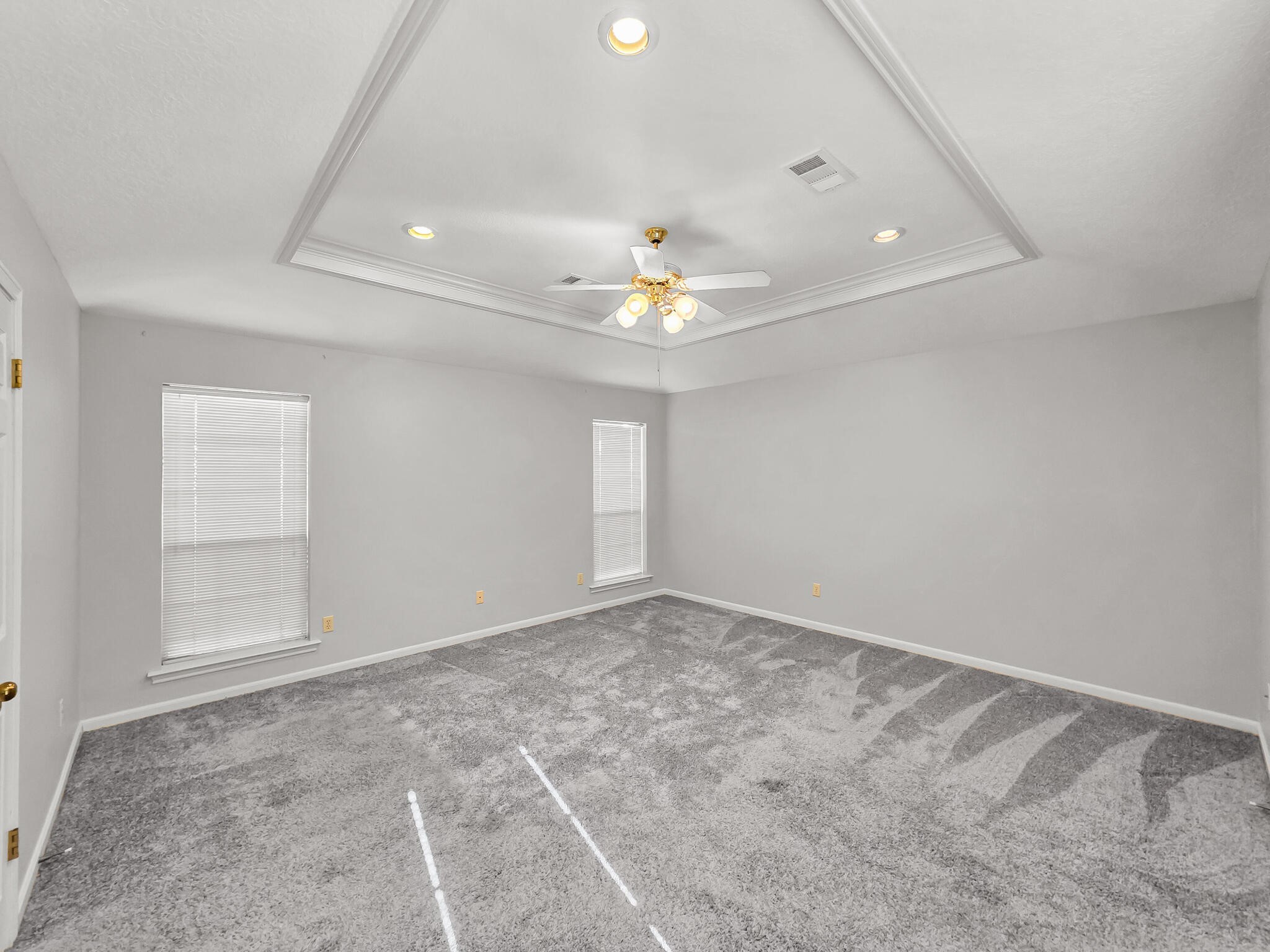 3910 Cypress Point Beaumont, TX 77707 - Photo 32 of 50 an empty room with chandelier fan and windows