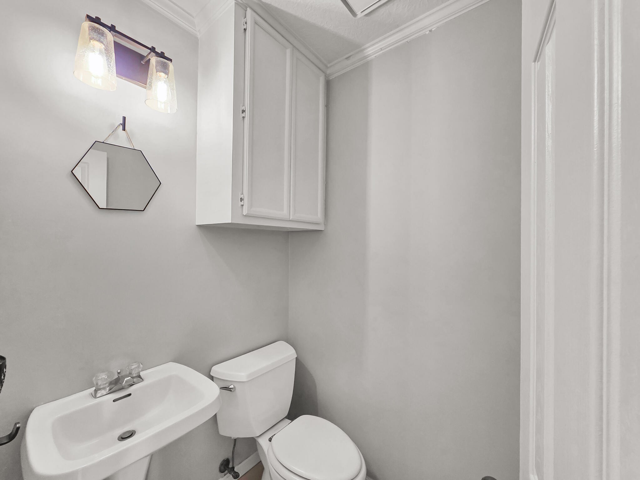 3910 Cypress Point Beaumont, TX 77707 - Photo 38 of 50 a bathroom with a toilet sink and mirror