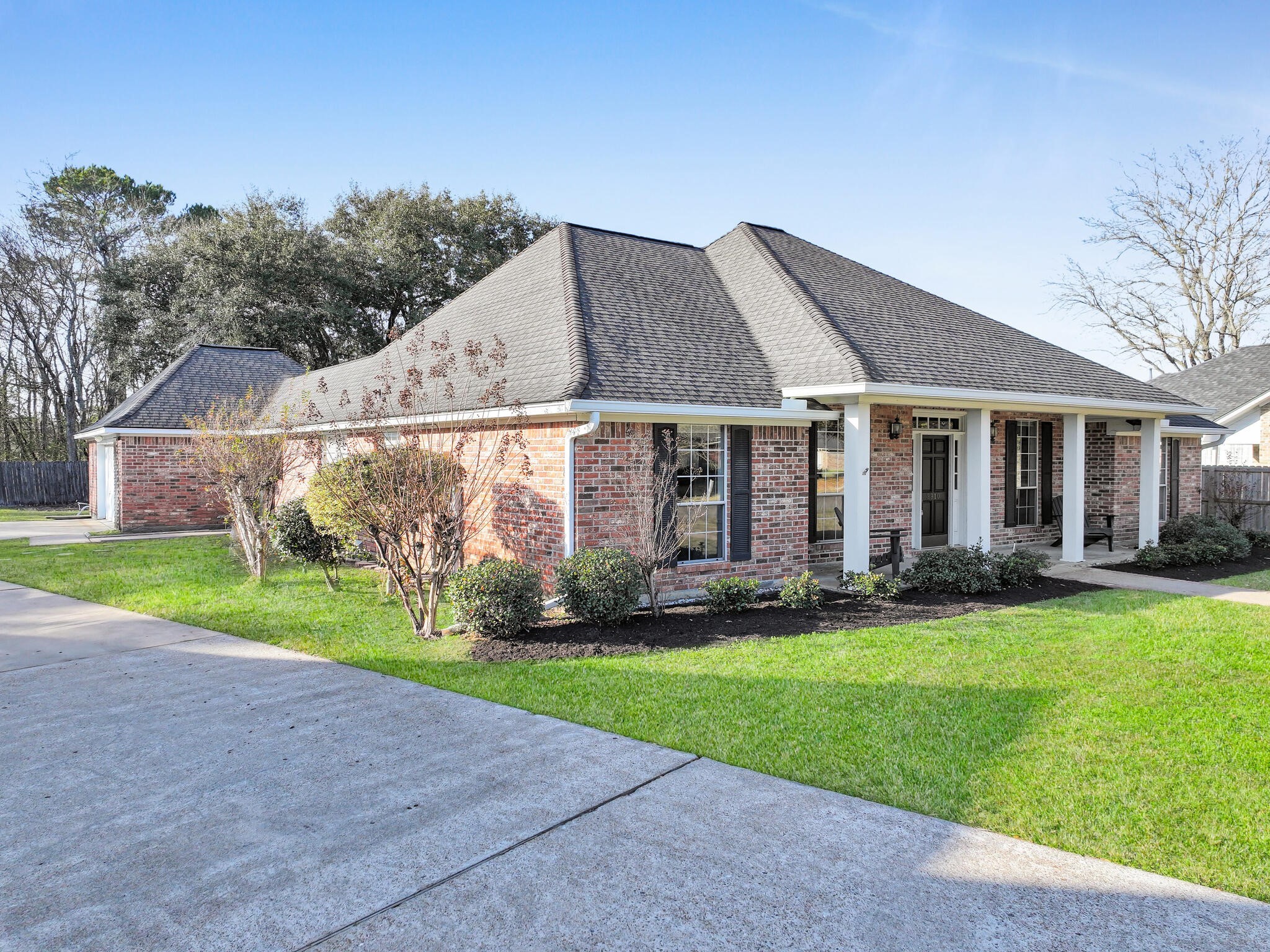 3910 Cypress Point Beaumont, TX 77707 - Photo 4 of 50 a front view of a house with a yard and garage