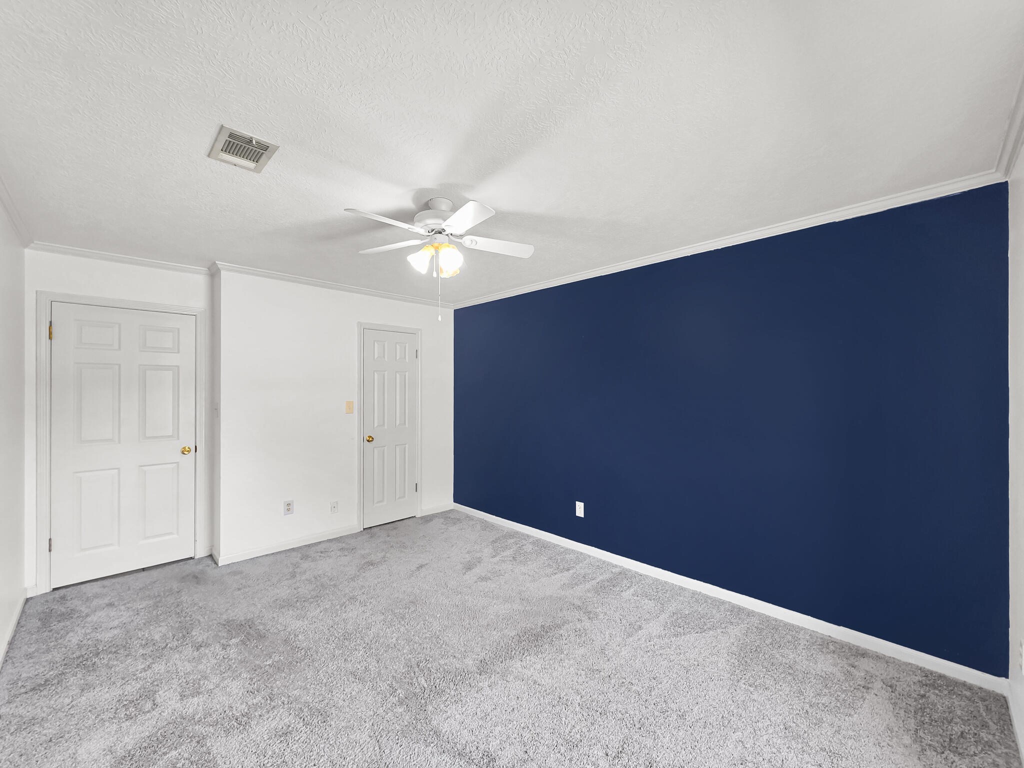 3910 Cypress Point Beaumont, TX 77707 - Photo 41 of 50 a view of an empty room with a chandelier fan
