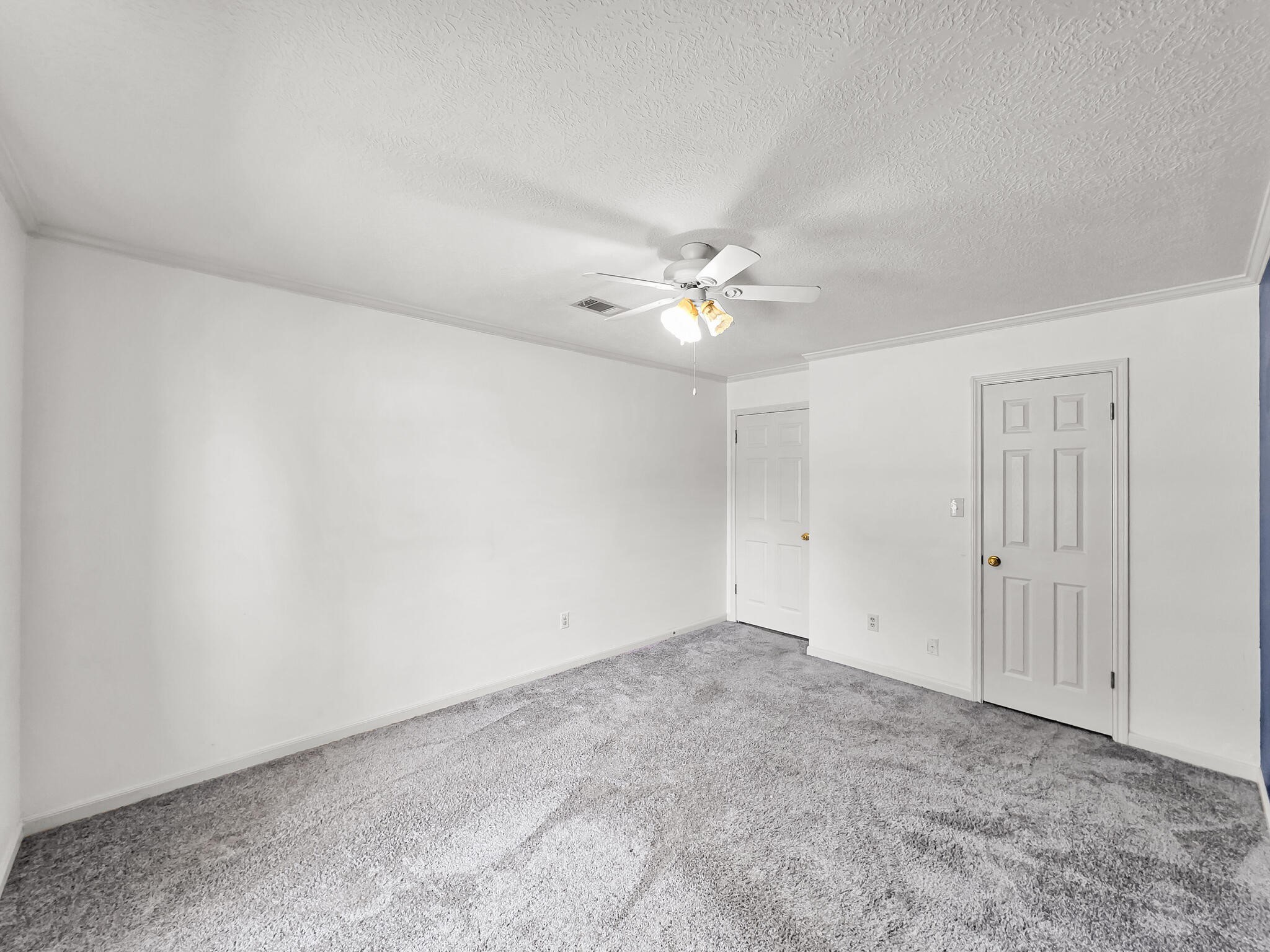 3910 Cypress Point Beaumont, TX 77707 - Photo 43 of 50 a view of an empty room with a chandelier fan