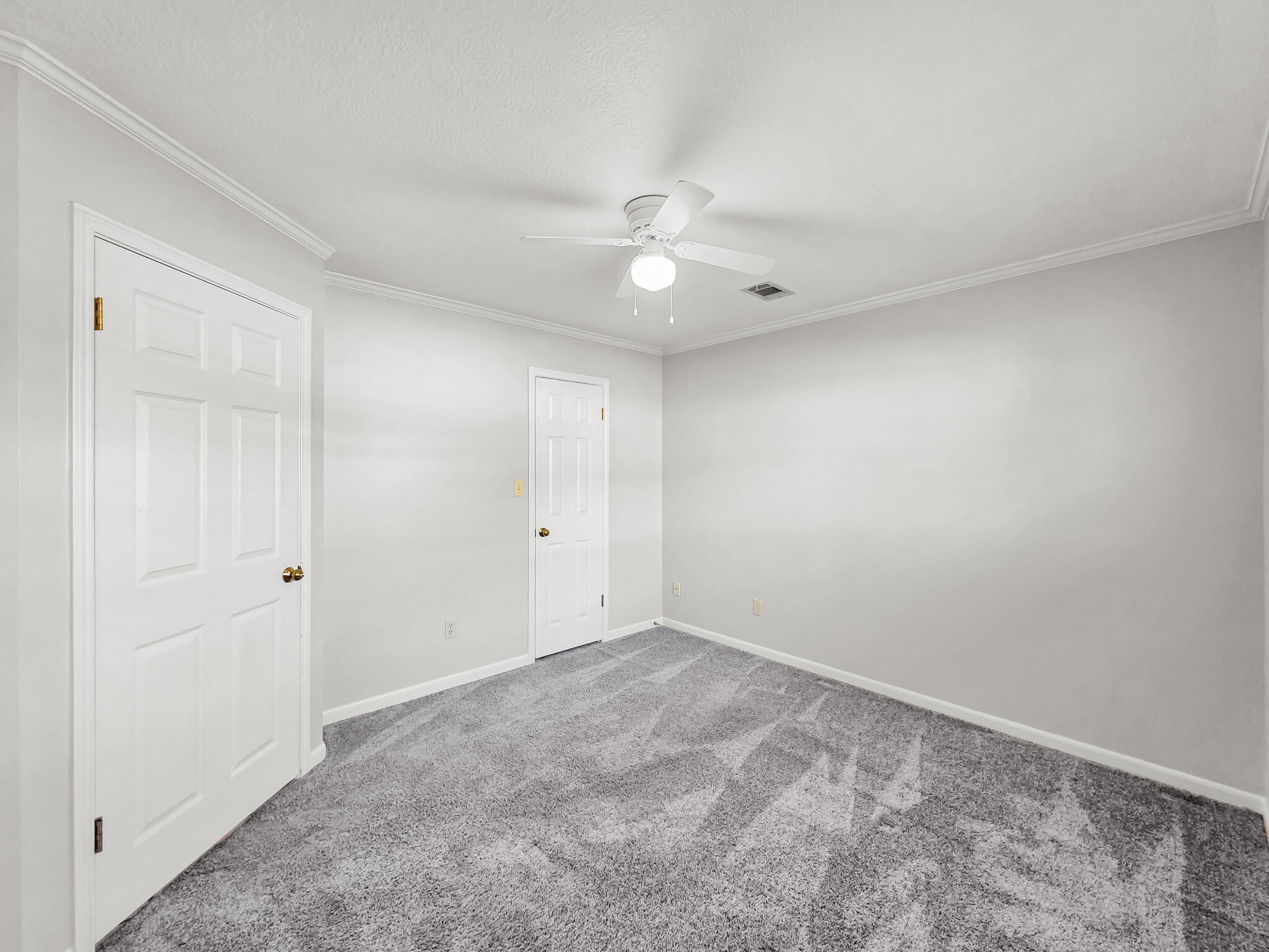 3910 Cypress Point Beaumont, TX 77707 - Photo 45 of 50 an empty room with a ceiling fan and a window