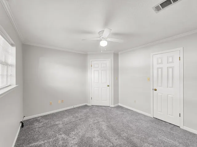 a view of an empty walk in closet