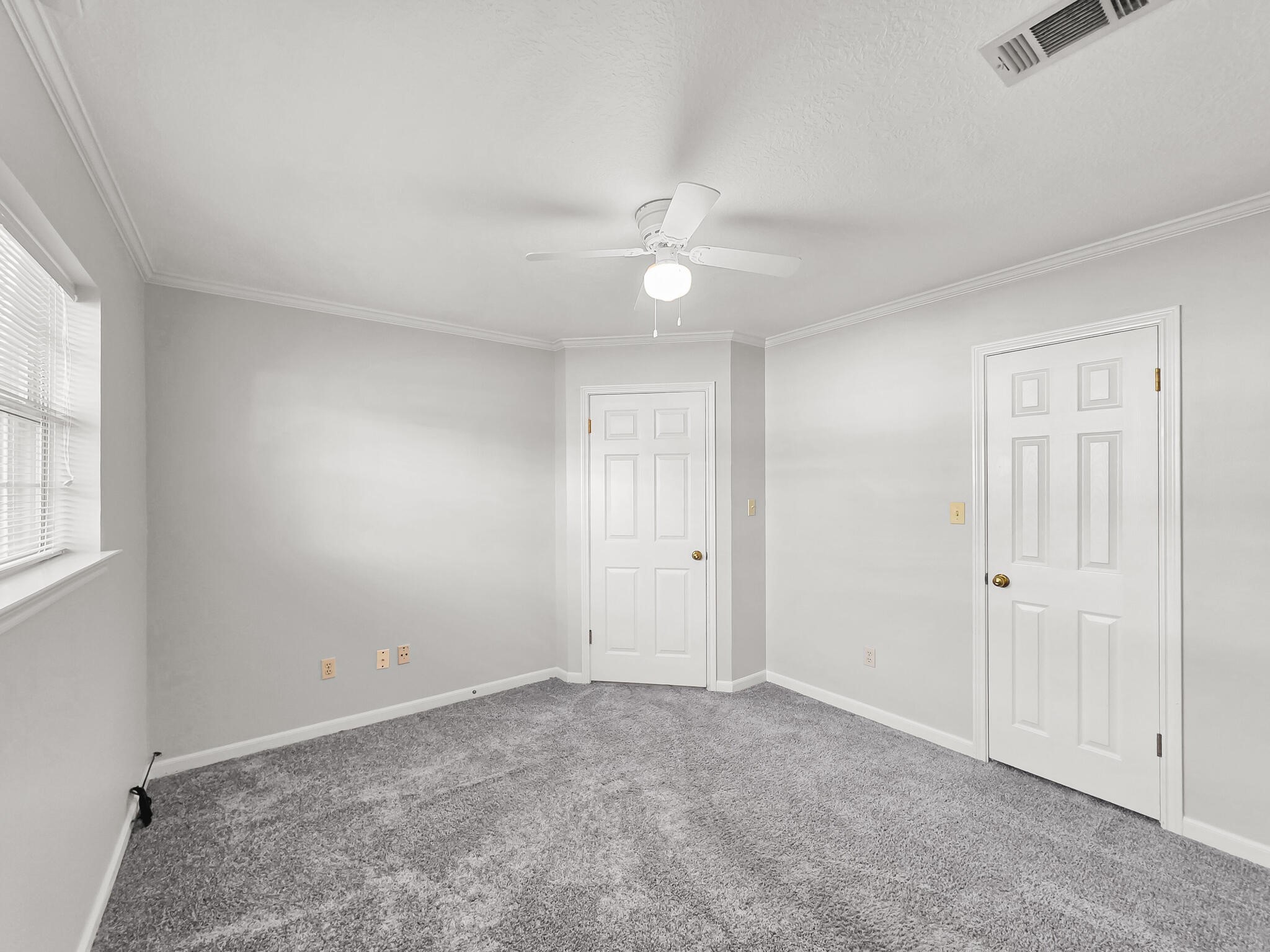 3910 Cypress Point Beaumont, TX 77707 - Photo 46 of 50 an empty room with windows and fan