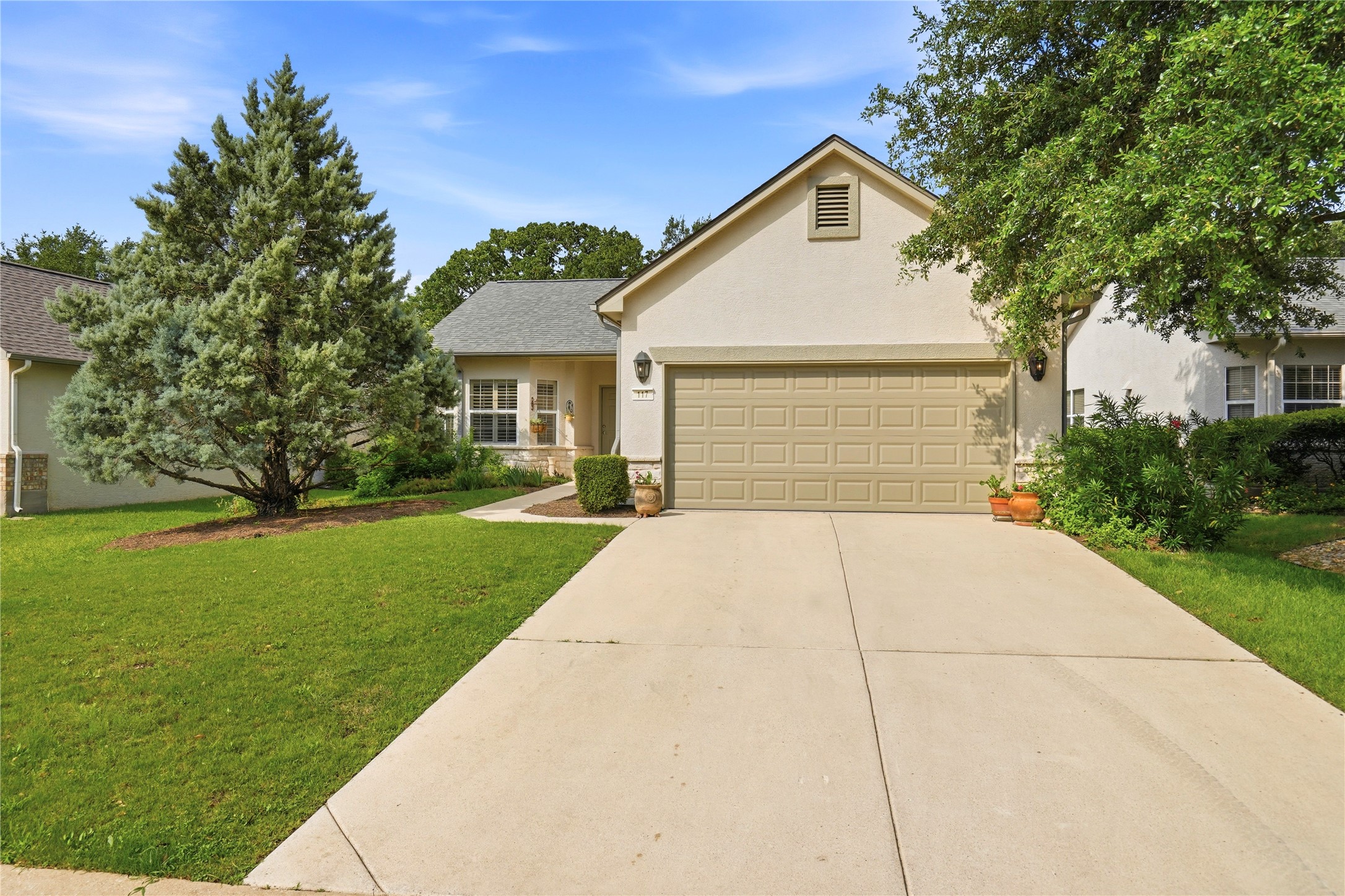 117 Whitewing Way Georgetown, TX 78633 - Photo 1 of 27 A well-maintained lawn and mature landscaping enhance this inviting stucco facade
