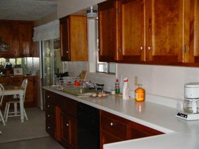 2407 Pine Grove Road Rogue River, OR 97537 - Photo 5 of 7 a kitchen with a sink a stove and cabinets