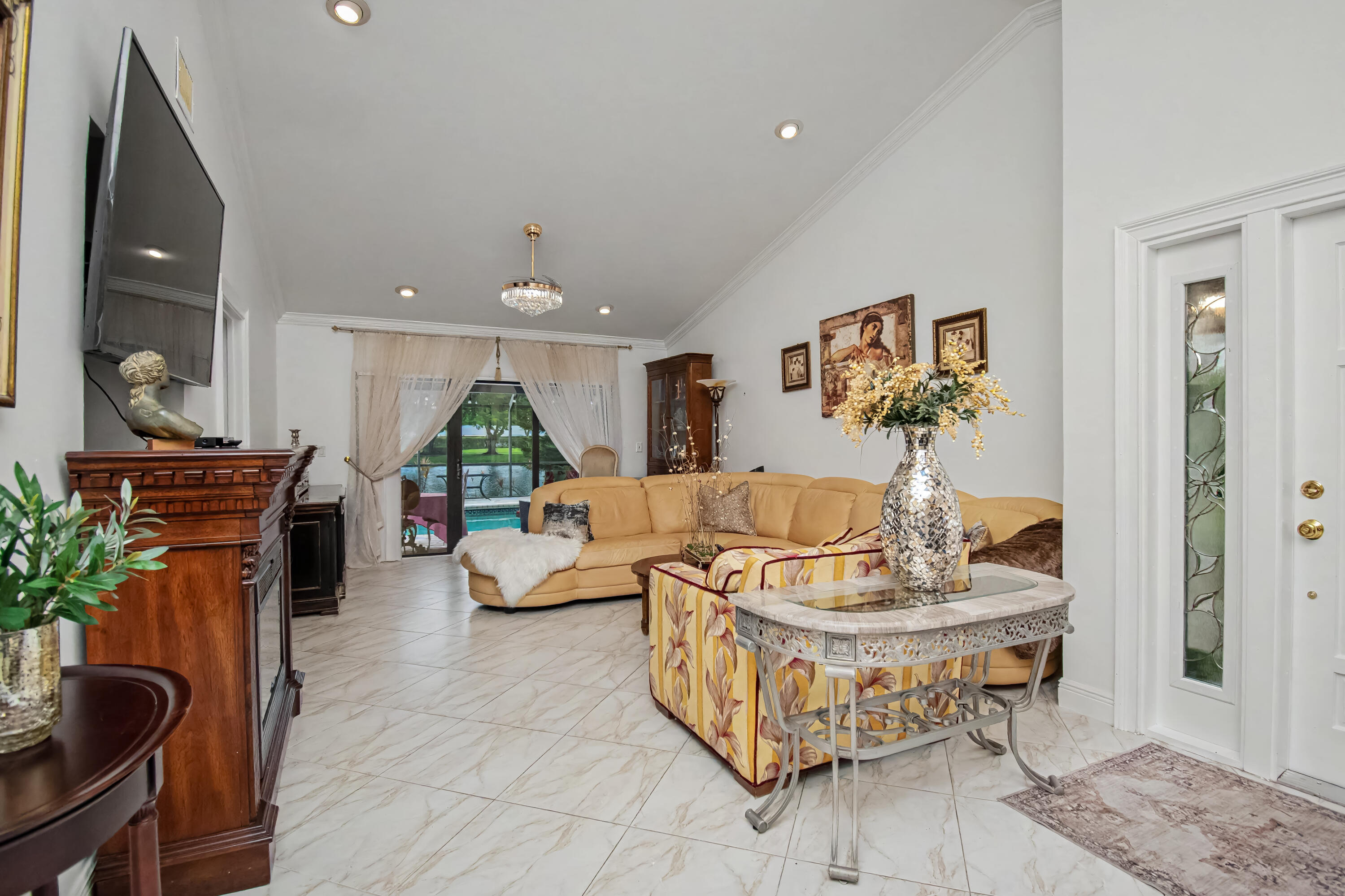 9708 Erica Court Boca Raton, FL 33496 - Photo 54 of 54 a living room with furniture and a wooden floor