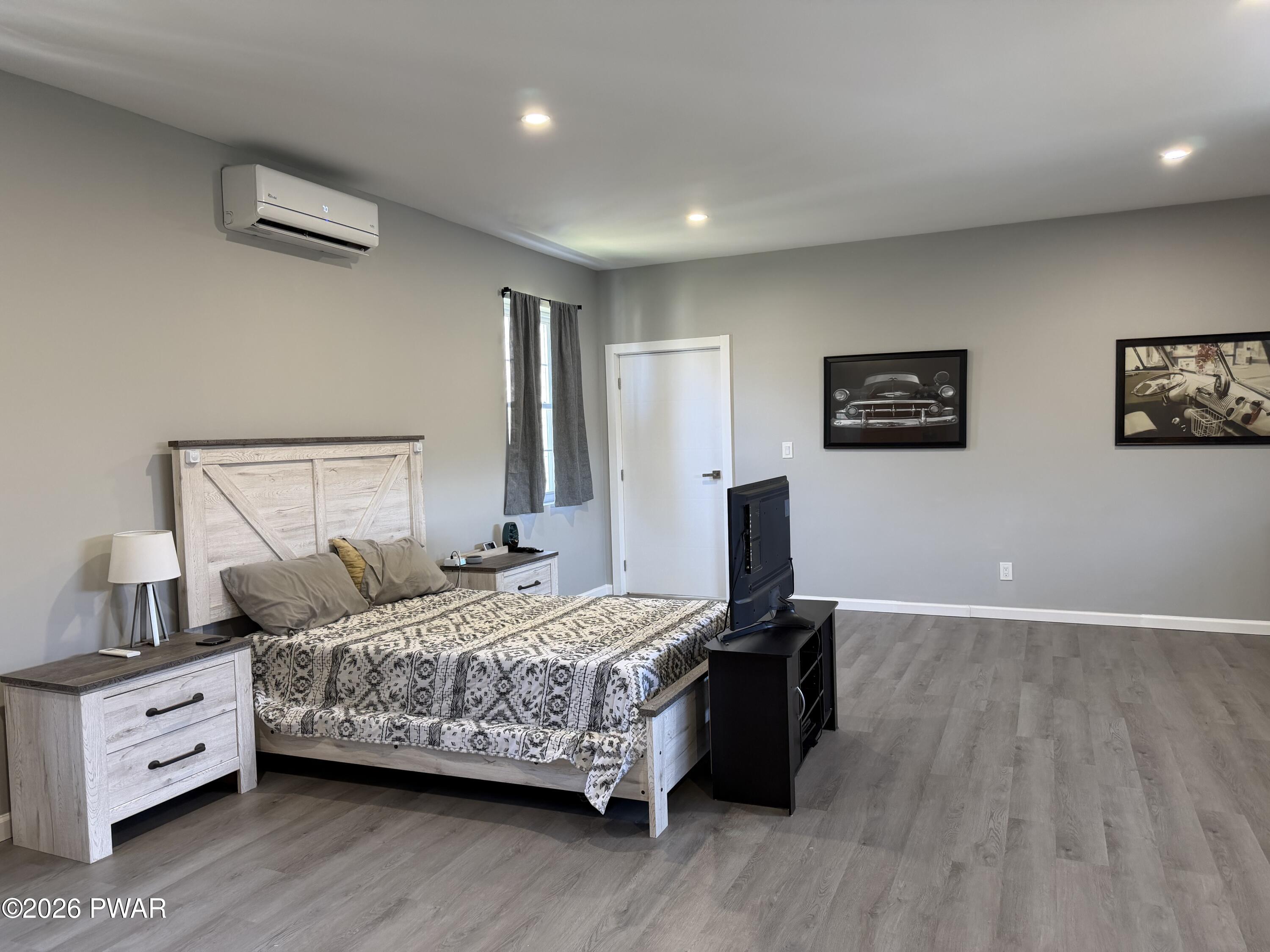801 Maple Ridge Court Hawley, PA 18428 - Photo 47 of 55 a bedroom with a bed and a night stand