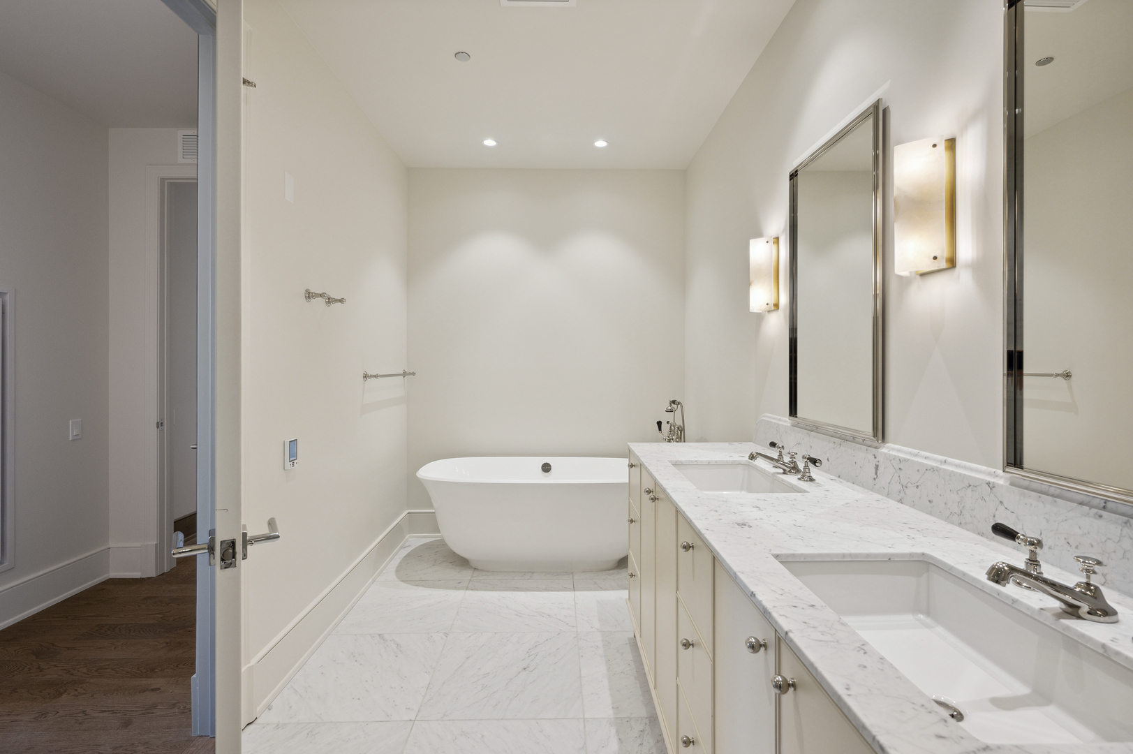 21 North May Street, Unit 1401 Chicago, IL 60607 - Photo 12 of 47 a bathroom with a sink double vanity and a mirror