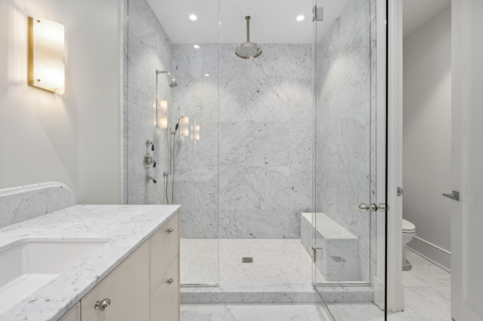 21 North May Street, Unit 1401 Chicago, IL 60607 - Photo 14 of 47 a bathroom with a sink a toilet and shower