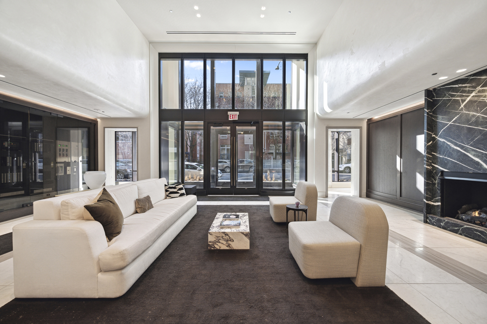 21 North May Street, Unit 1401 Chicago, IL 60607 - Photo 2 of 47 a living room with furniture and a fireplace