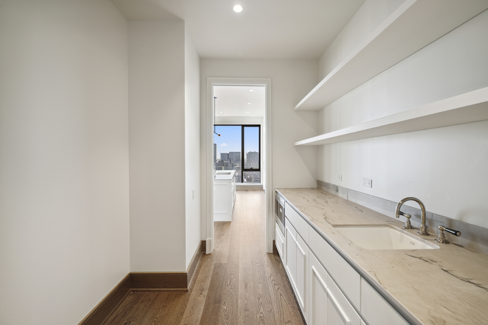 21 North May Street, Unit 1401 Chicago, IL 60607 - Photo 40 of 47 a bathroom with a sink and a wooden floor