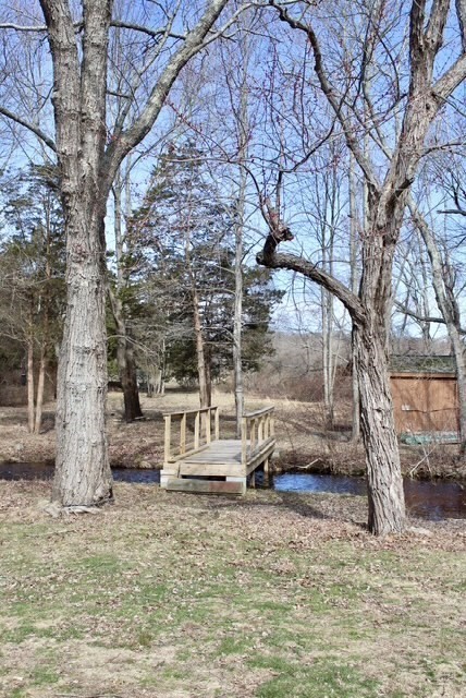 118 South Main Street, Unit 2 Freetown, MA 02702 - Photo 3 of 16 a view of a house with a yard covered in snow