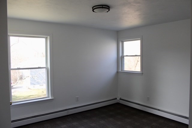 118 South Main Street, Unit 2 Freetown, MA 02702 - Photo 9 of 16 an empty room with a window