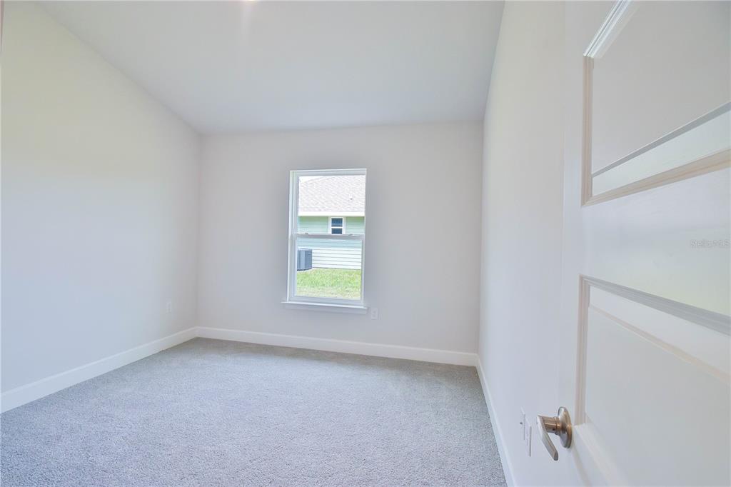 1772 Roberts Trail Bell, FL 32619 - Photo 18 of 26 an empty room with a window