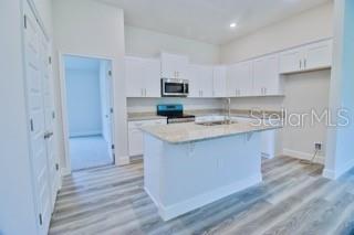 1772 Roberts Trail Bell, FL 32619 - Photo 2 of 26 a kitchen with stainless steel appliances granite countertop a sink stove and refrigerator