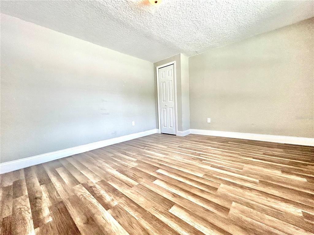 418 Charles Street Winter Garden, FL 34787 - Photo 13 of 27 a view of a room with wooden floor