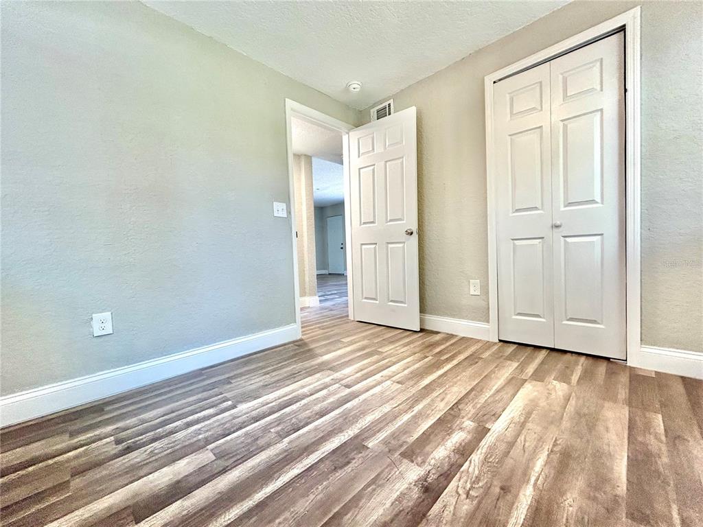 418 Charles Street Winter Garden, FL 34787 - Photo 18 of 27 a view of an empty room and wooden floor