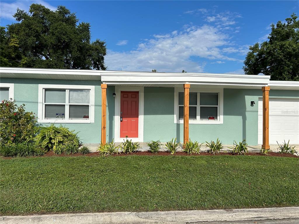 418 Charles Street Winter Garden, FL 34787 - Photo 2 of 27 a front view of a house with a yard