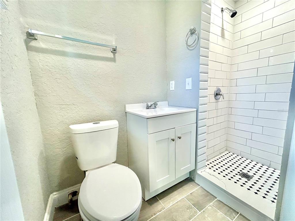 418 Charles Street Winter Garden, FL 34787 - Photo 23 of 27 a bathroom with a sink toilet and shower